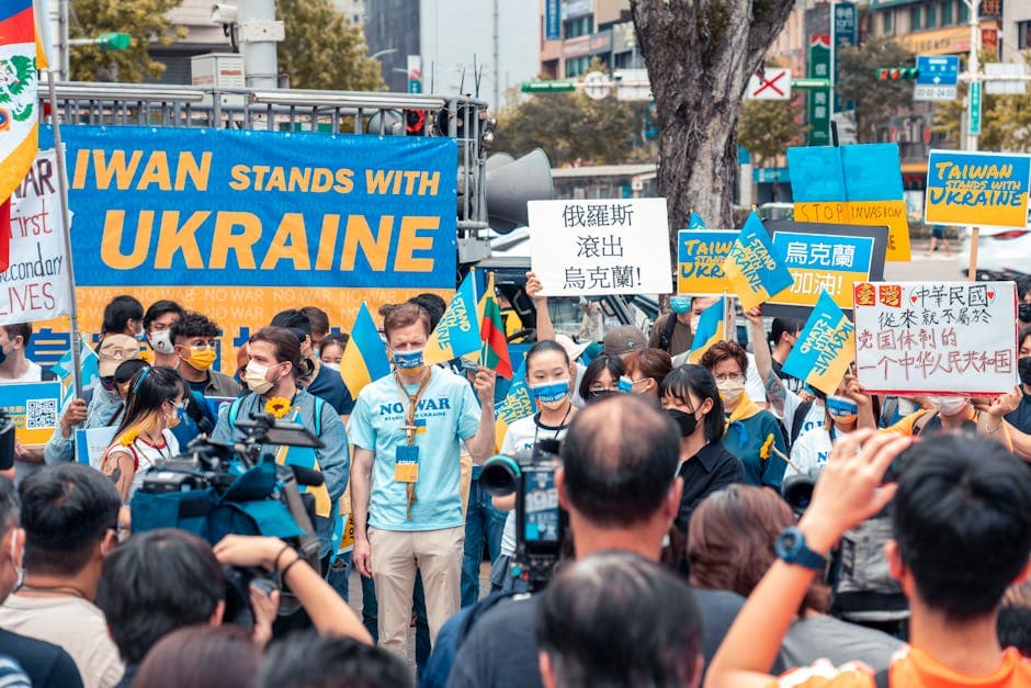 Group of Taiwan protesters rallying in support of Ukraine, holding signs and flags on the street.