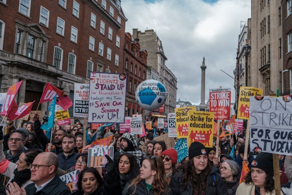 A vibrant demonstration in London advocating for educational reform and support.