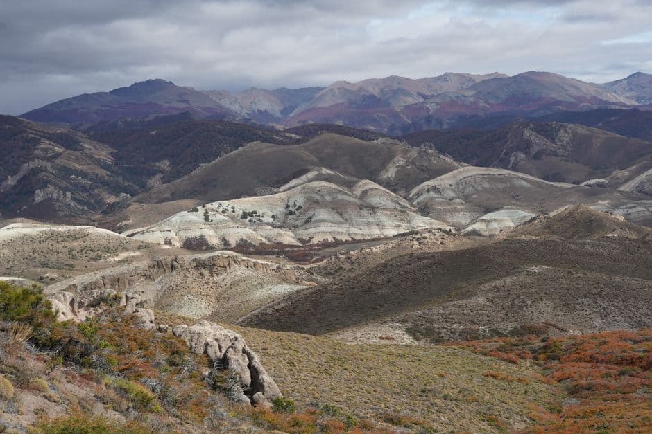 Captivating aerial shot of San Carlos de Bariloche's picturesque hills and rugged terrain.