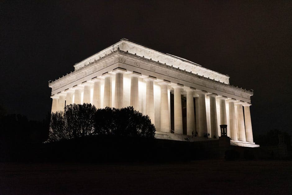Stunning night view of the Lincoln Memorial illuminated against a dark sky in Washington DC.