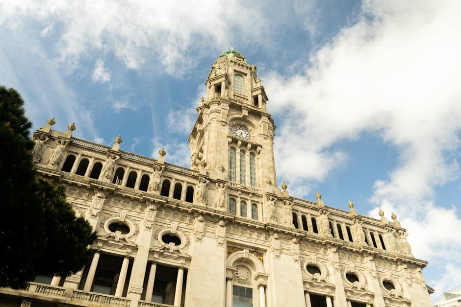 A majestic view of the Porto City Hall under a clear blue sky, highlighting its architectural elegance.