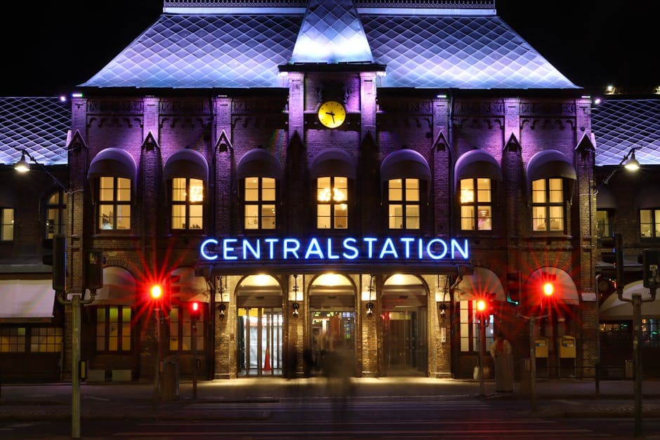 Stunning night shot of Gothenburg Central Station with vibrant lighting.