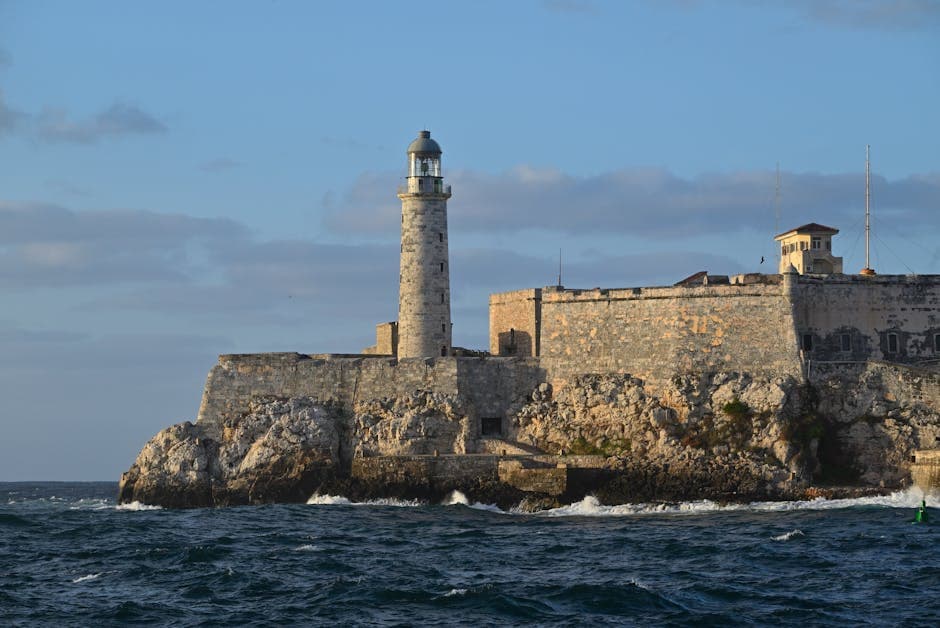 El Morro Lighthouse stands proudly over the waters of Havana Bay in Cuba, showcasing historical architecture.