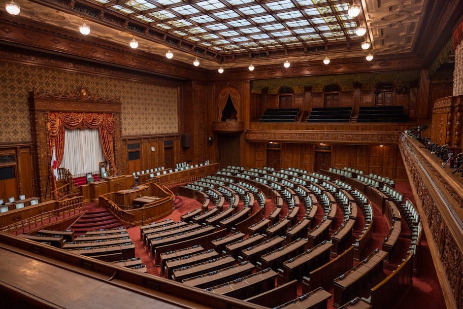 Captivating wide-angle view of a classic legislative assembly hall with ornate wood design.