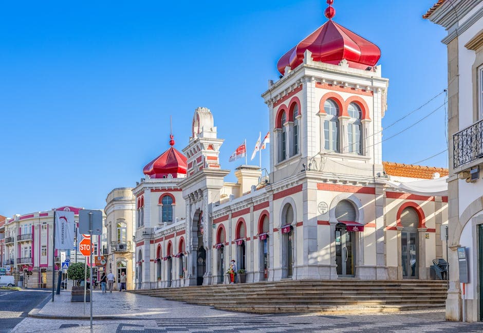 Stunning view of the iconic Loulé Market with distinct Moorish architecture under a bright blue sky.