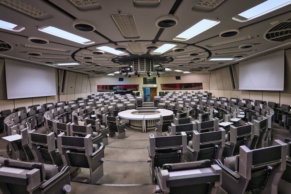 Empty futuristic conference room in Berlin ICC with circular seating and high-tech design.
