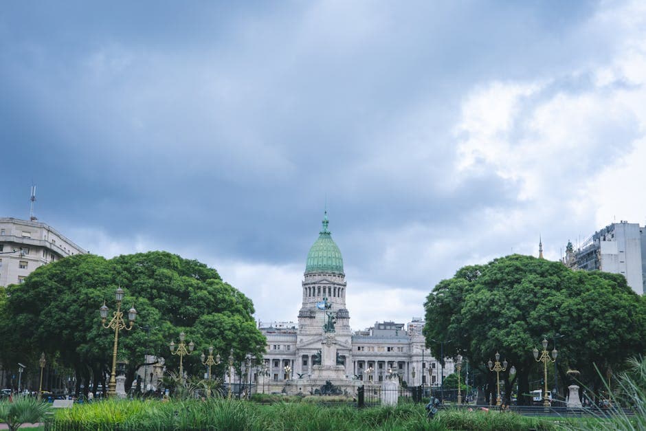 View of the iconic National Congress Building in Buenos Aires with cloudy sky.