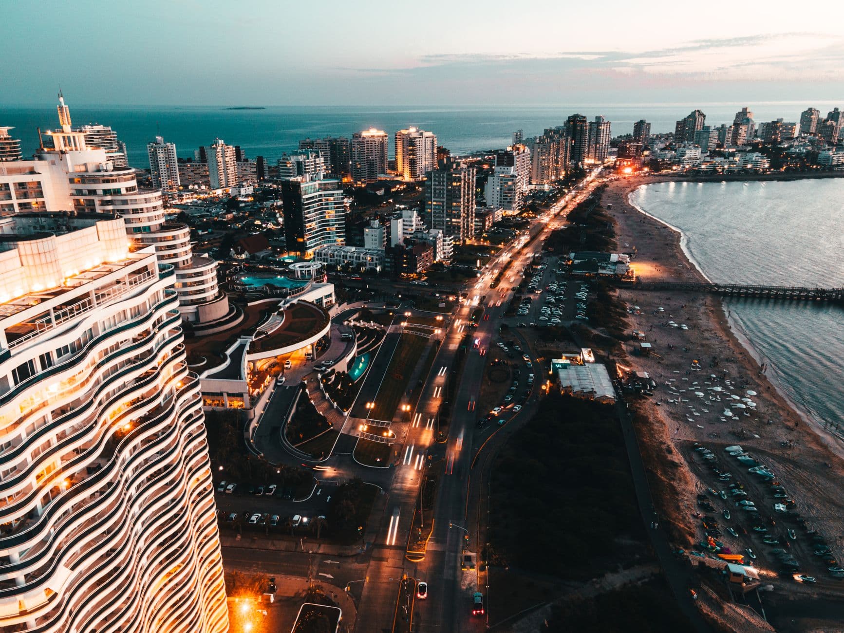 A breathtaking aerial shot of Punta del Este showcasing the waterfront and vibrant cityscape at twilight.