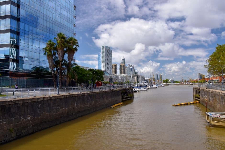 Explore the modern architecture and scenic waterfront of Buenos Aires on a bright day.