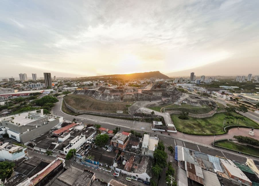 Drone view capturing the scenic sunset over the historic fortress in Cartagena.