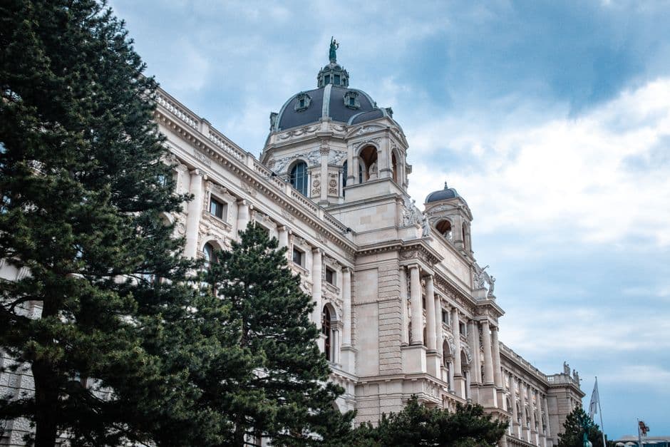 Stunning view of the Kunsthistorisches Museum in Vienna under a cloudy sky.