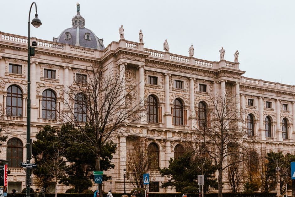 Classical architecture of a historic building in Vienna, Austria, with overcast weather.