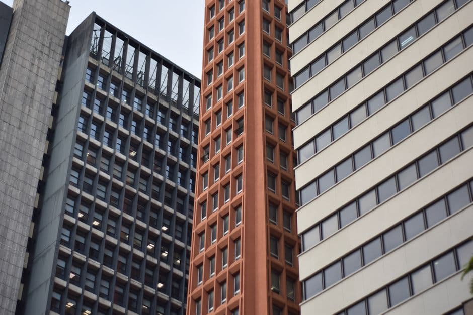 Close-up of modern skyscrapers with diverse architectural styles and glass facades.
