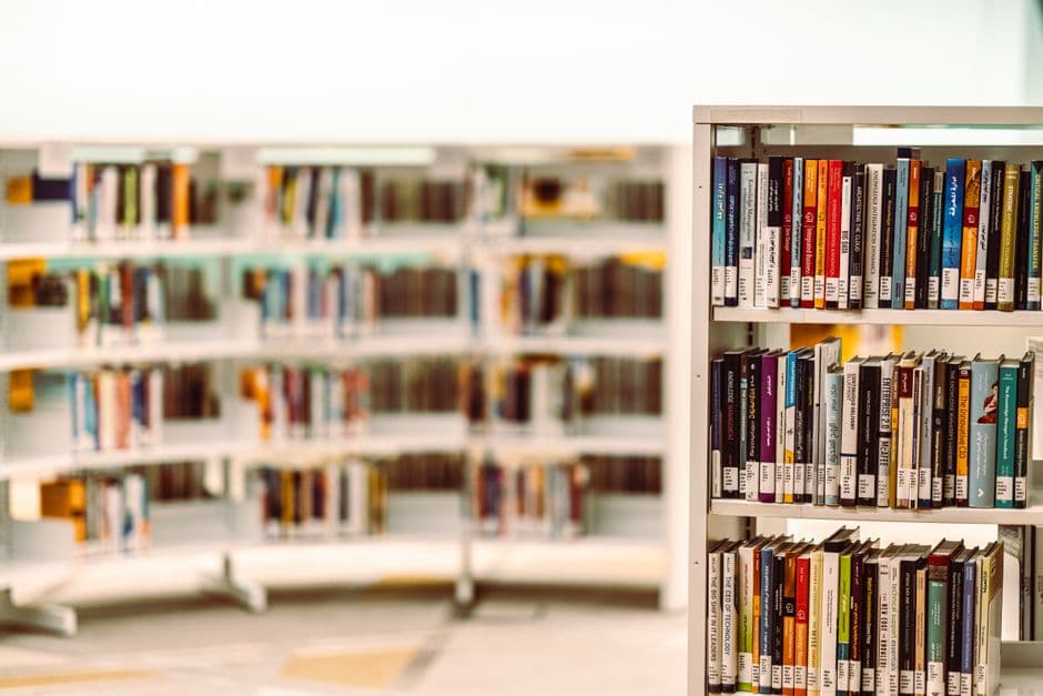 Explore a modern library setup with neatly arranged books and ample shelves in Dubai's interior space.