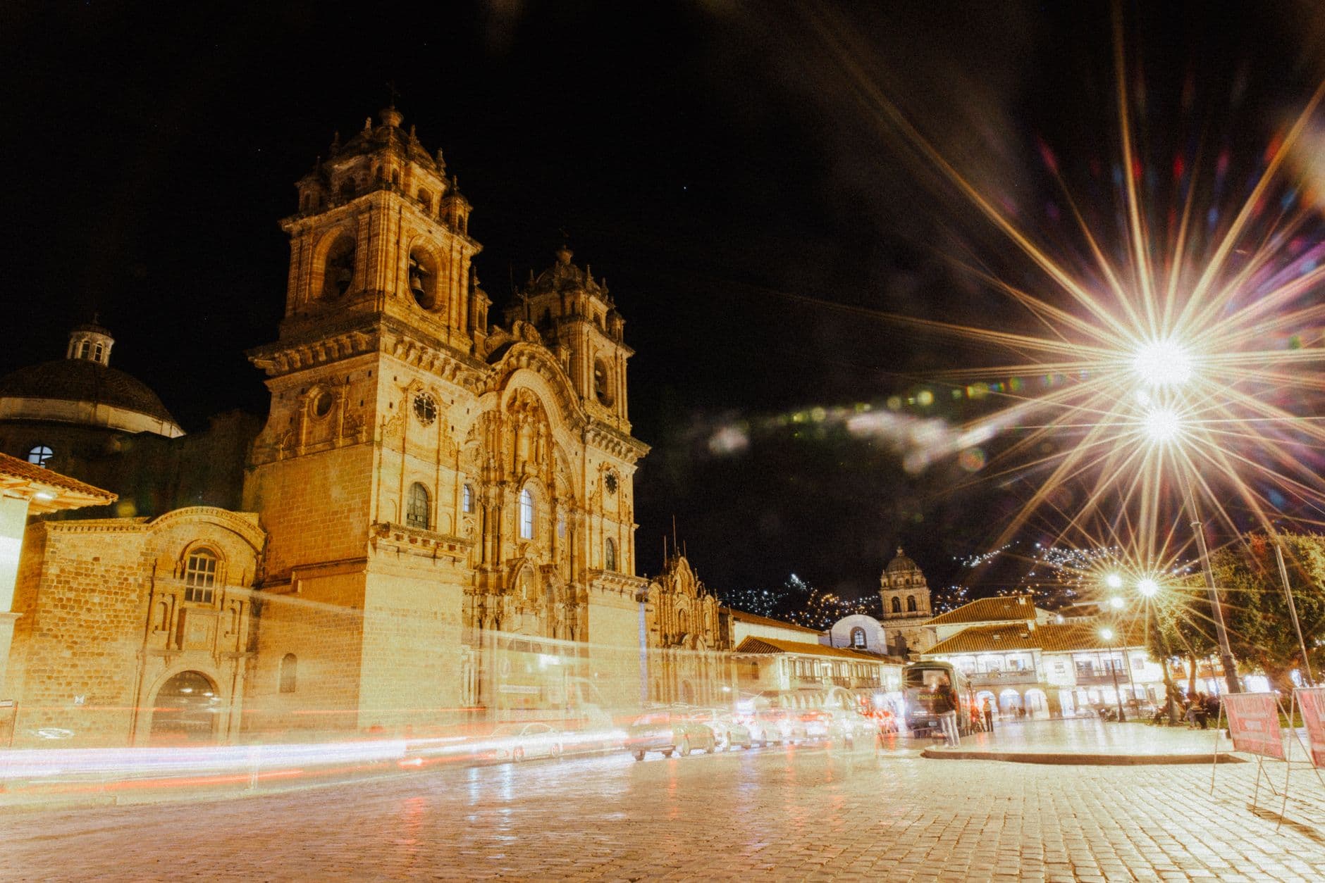 Long exposure night shot of Cusco Cathedral, Peru, capturing the illuminated streets and vibrant atmosphere.
