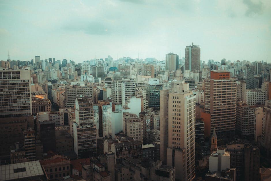 A panoramic view of Sao Paulo's urban skyline, showcasing dense modern skyscrapers.