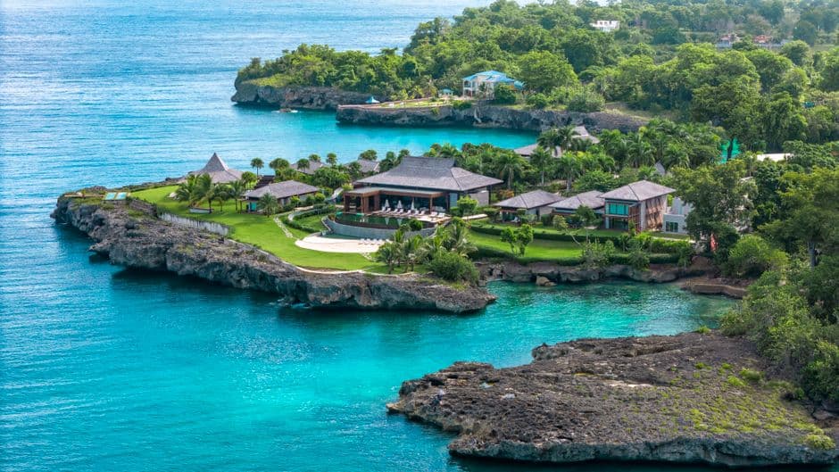 Stunning aerial photo of a luxury resort surrounded by turquoise waters in Rio San Juan, Dominican Republic.