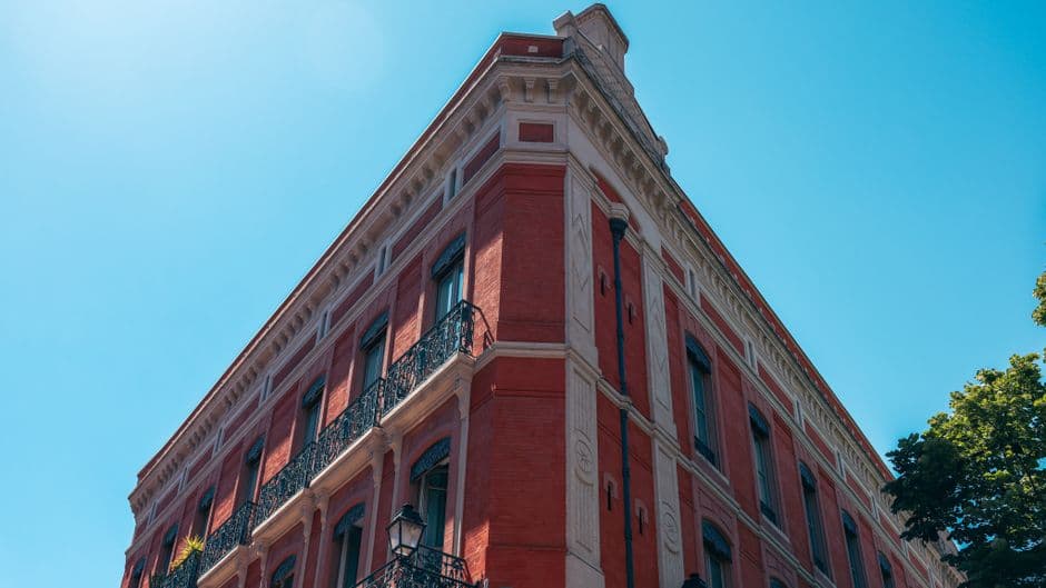 Stunning red brick historic building in Toulouse, France, under a clear blue sky.