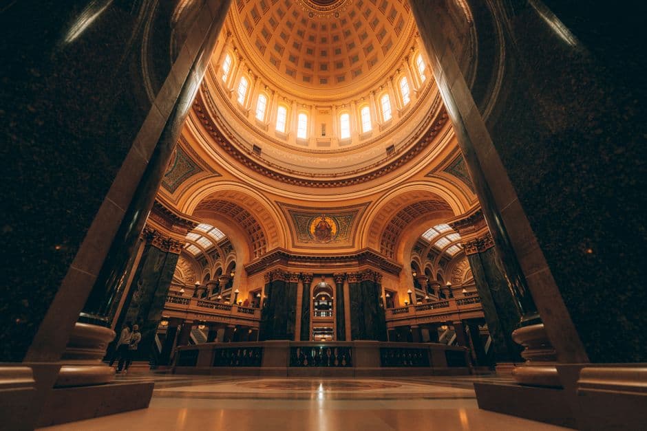 Stunning view of a grand dome interior with intricate architecture and warm lighting.