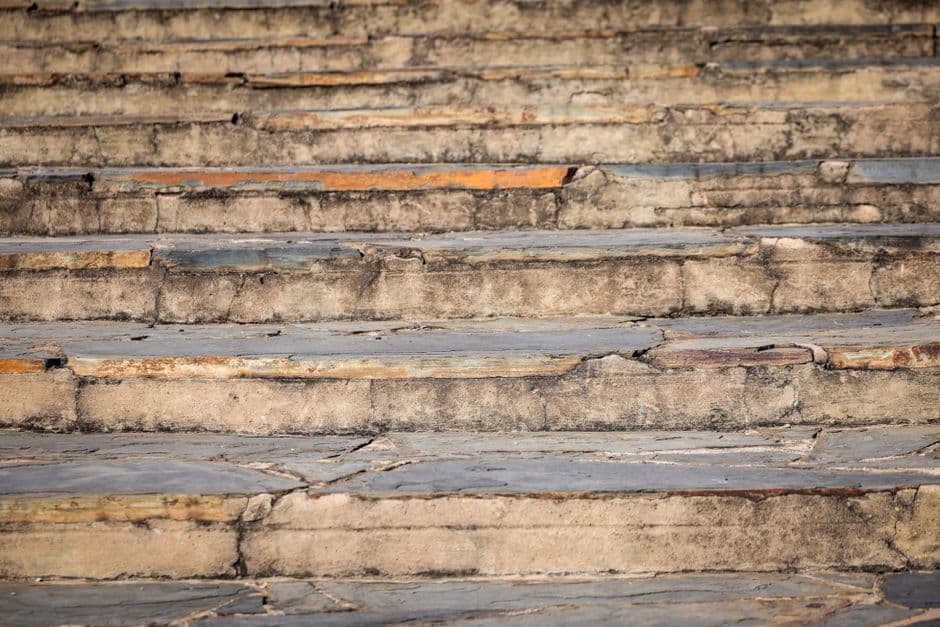 Close-up view of weathered stone steps showing unique texture and rustic charm.