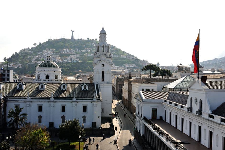 Aerial view of colonial buildings and El Panecillo in Quito, Ecuador.