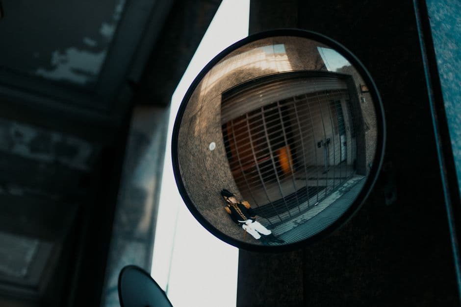 Captivating view through a security mirror reflecting a street scene in Belgrano, Buenos Aires.