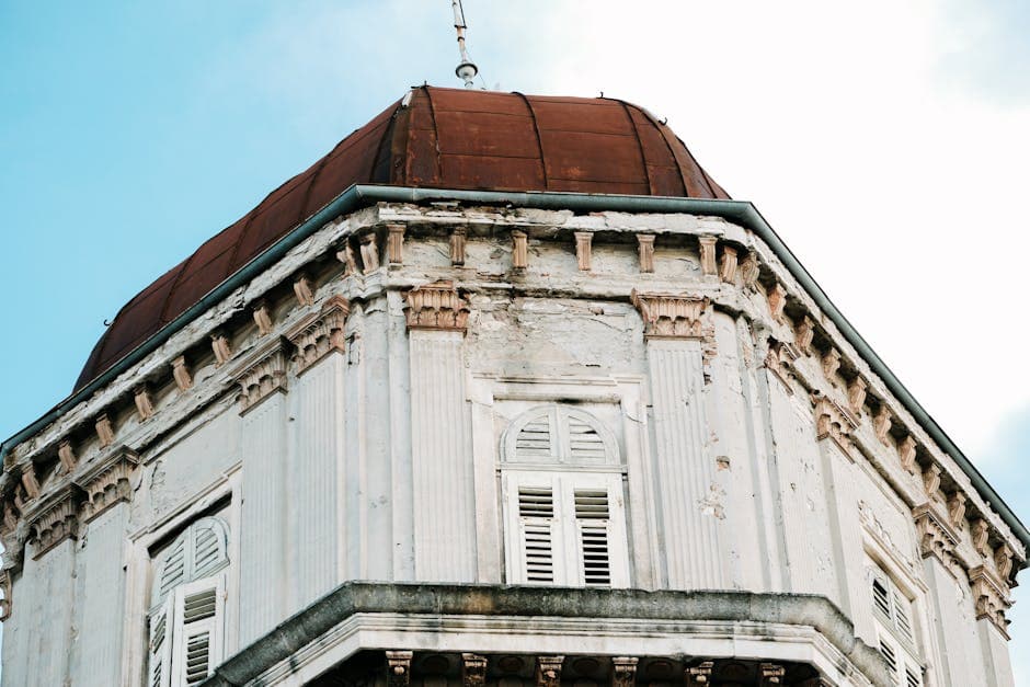 Close-up of a weathered historic building dome in Croatia, showcasing vintage architecture style.