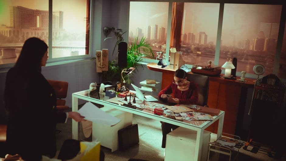 Professional office setting with two adults engaged in work in Baghdad, Iraq.
