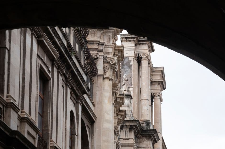 Capture of iconic Baroque architecture in Catania, showcasing ornate columns and intricate stonework.