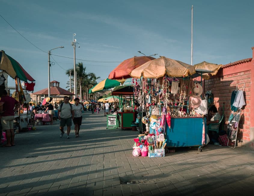 Vibrant street market in Trujillo, Peru with colorful stalls and local vendors.