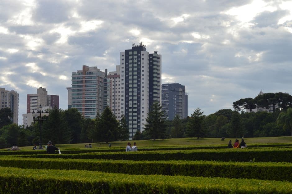 Explore the blend of nature and architecture in Curitiba's skyline from the Botanical Garden.