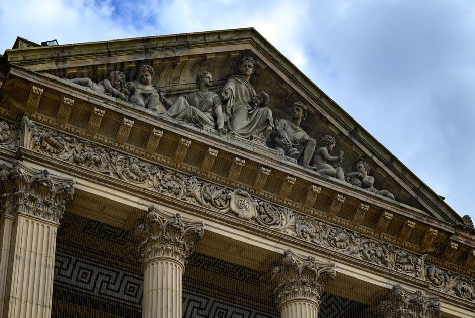 Detailed capture of ornate classical architecture with sculptures in England.