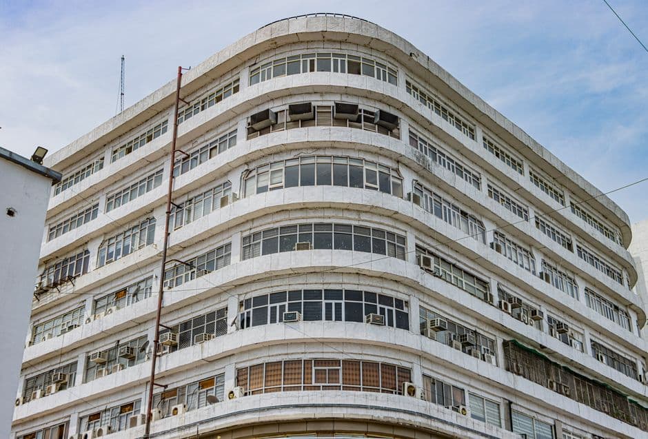 A modernist building in New Delhi, showcasing architectural symmetry and urban aesthetics.