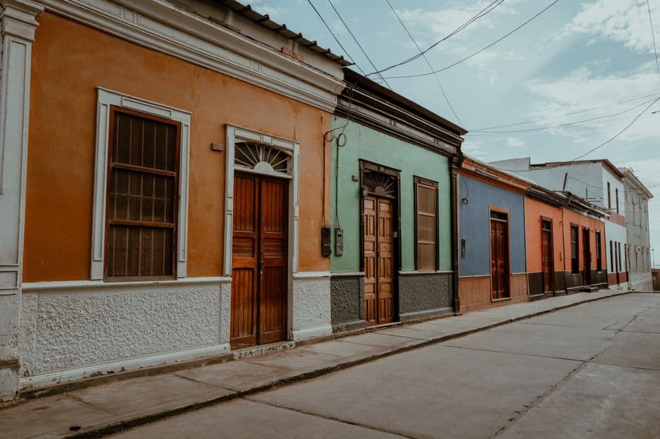 Vibrant traditional architecture in a colorful street of Pacasmayo, Peru.