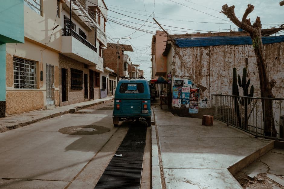 A quiet street in Pacasmayo, Peru, showcasing local architecture and a vibrant atmosphere.