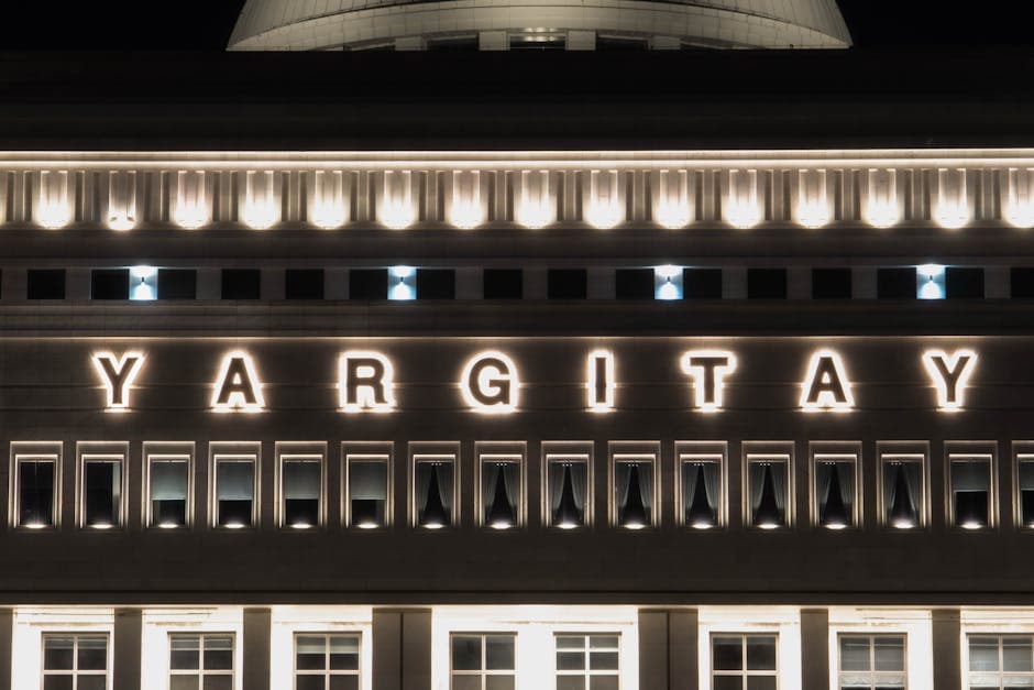 Night view of the illuminated Yargıtay building facade in Ankara, Turkey.