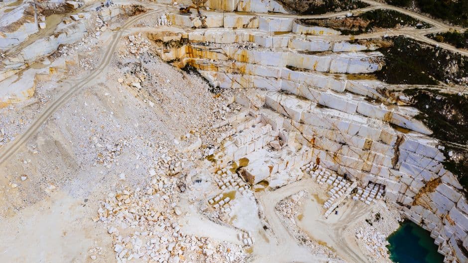 Stunning aerial shot of a marble quarry in Thessaloniki, Greece showcasing the intricate patterns and colors.