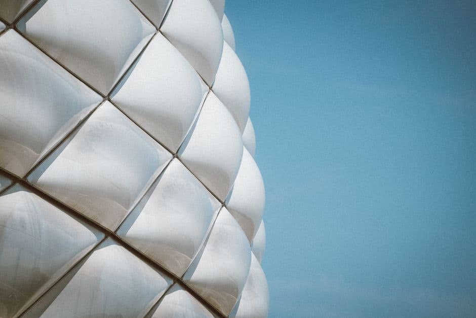 Close-up view of Allianz Arena facade against blue sky, Munich, Germany.