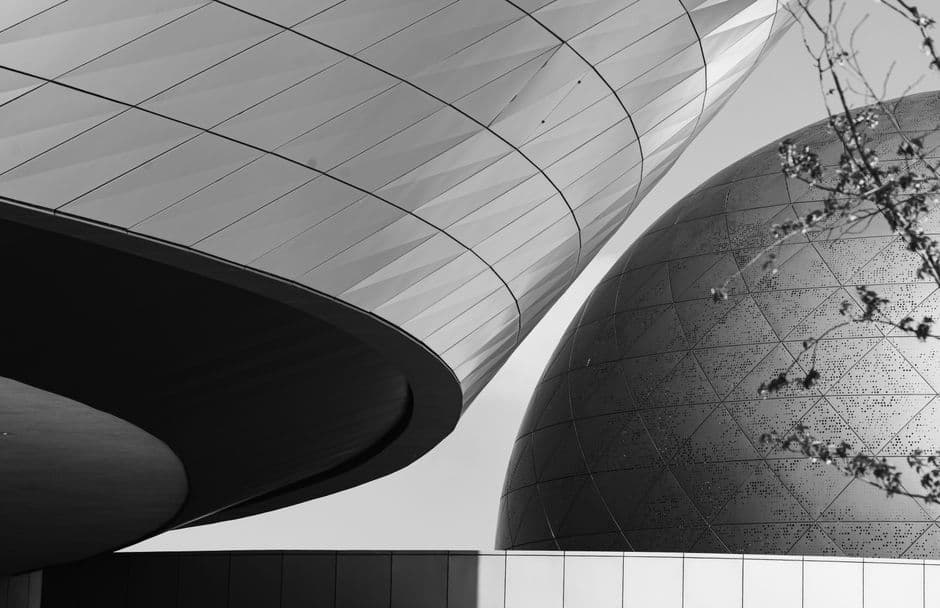 Monochrome abstract close-up of modern architectural structures with geometric patterns.