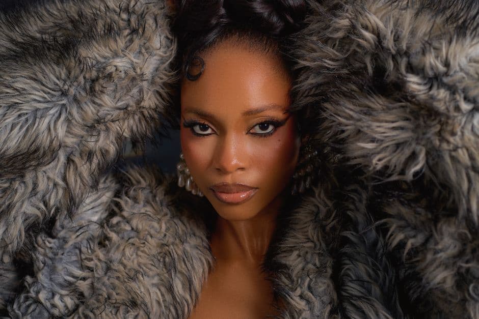 Striking portrait of a woman wearing a fur coat, taken with a focus on beauty and style.