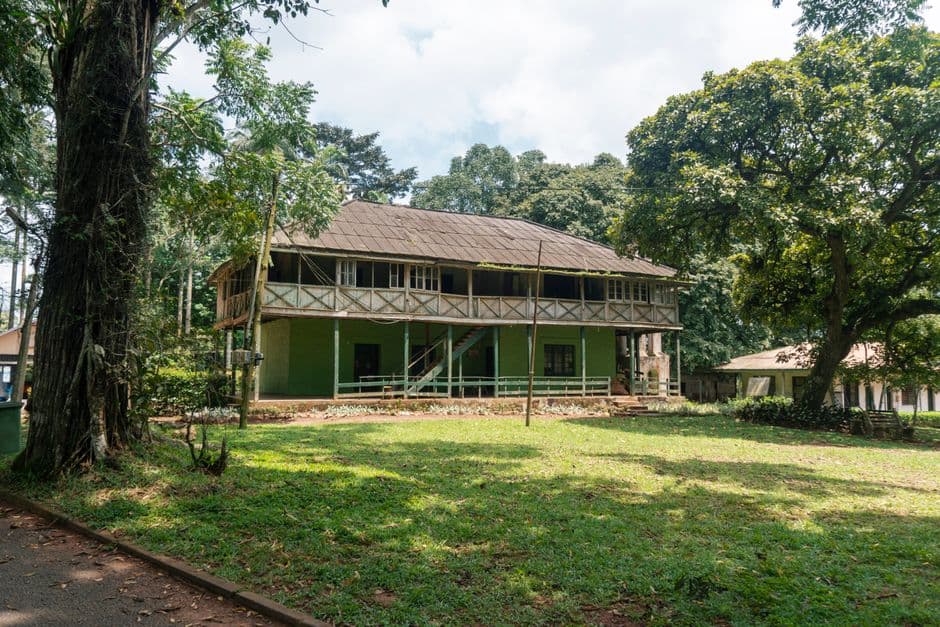 A charming colonial-era house with lush greenery in Eastern Region, Ghana.