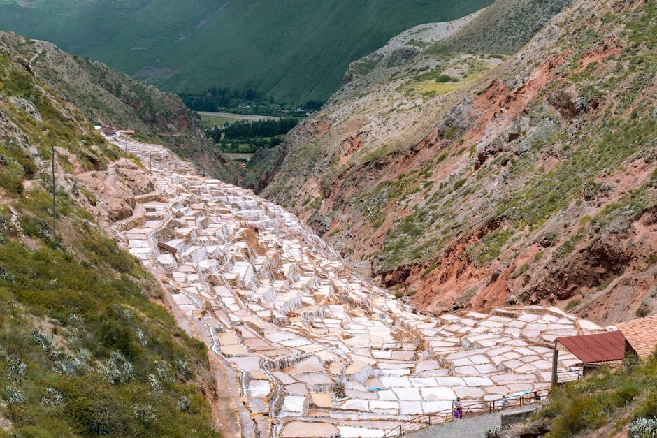 Stunning aerial view of the cascading Maras Salt Mines in Cuzco, Peru.