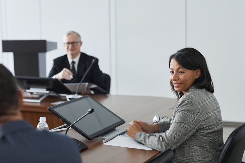 Business professionals engaged in a meeting, focused on diversity and collaboration.