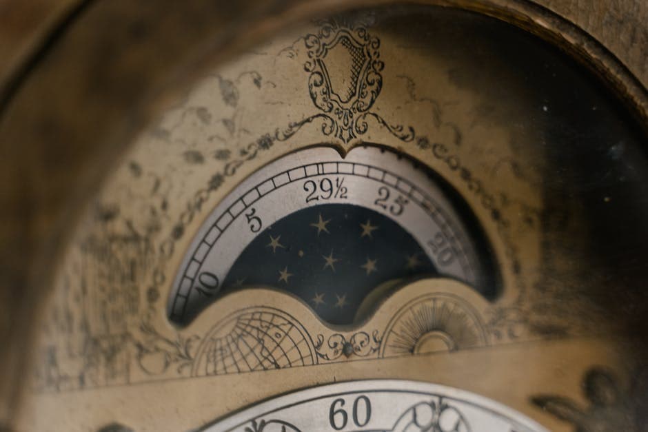 Close-up of an antique barometer showing intricate design and numbers.