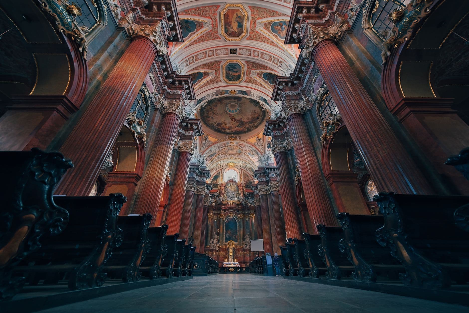 A stunning view of the ornate Baroque interior of a cathedral in Poznań, Poland.