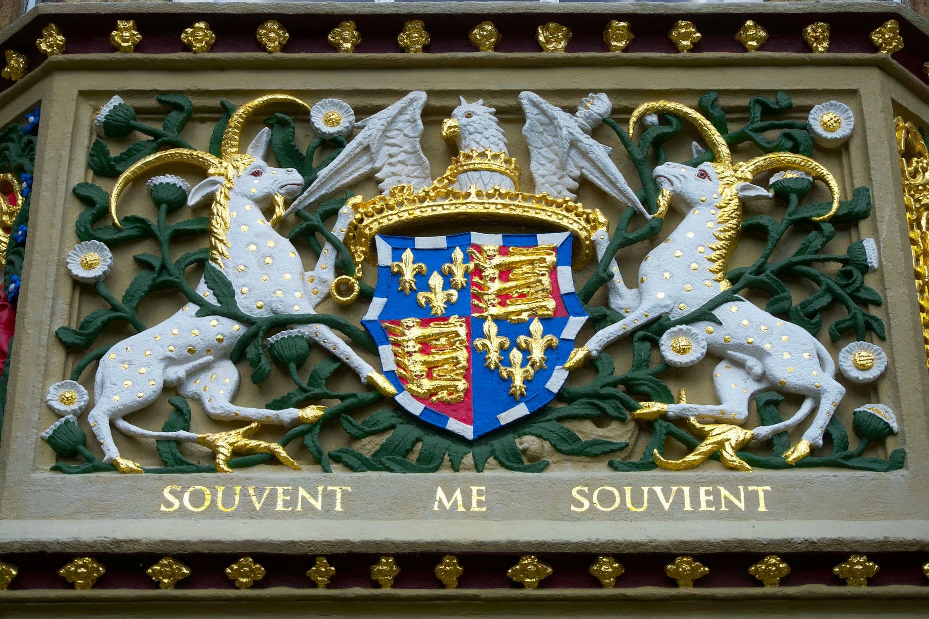 Close-up of the detailed bas relief crest at Christ's College, Cambridge, UK.