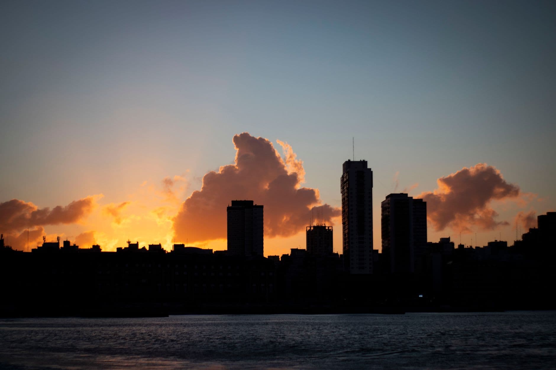 Captivating silhouette of Mar del Plata skyline during sunset, reflecting upon the Atlantic coast.