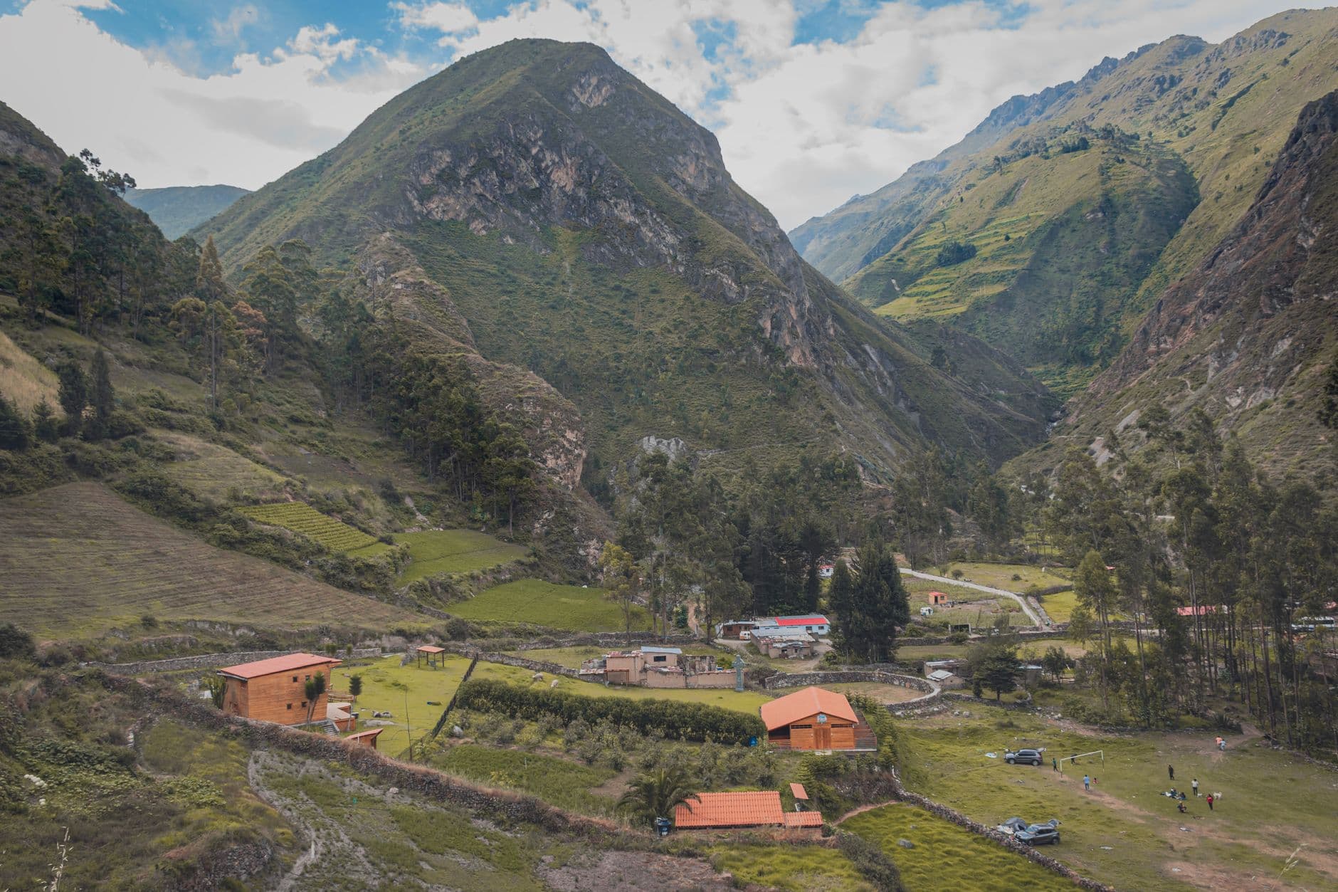 Explore the picturesque mountain village nestled in Huarochirí, Peru, with lush greenery and vibrant landscapes.