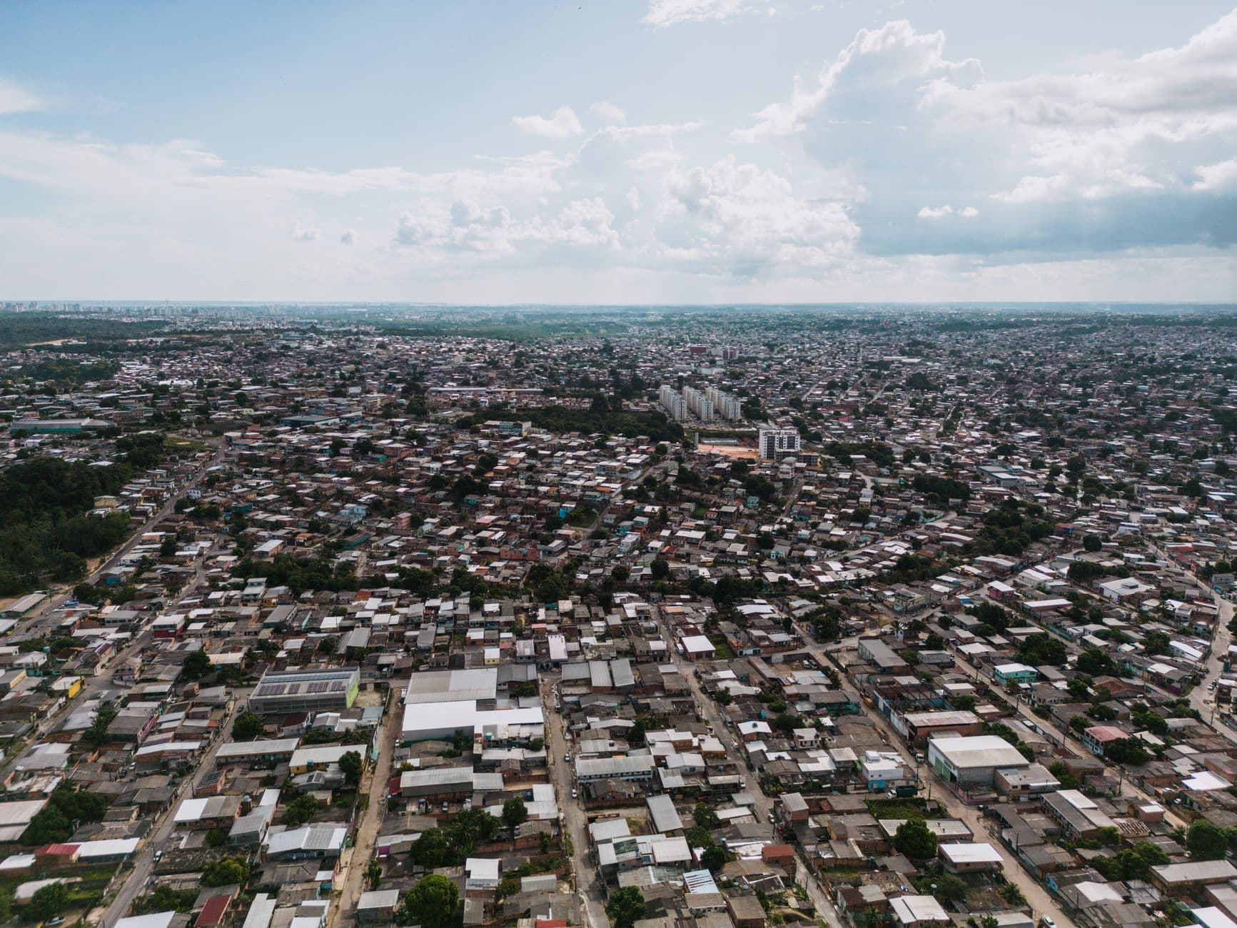 Expansive aerial view of São José Operário, showcasing dense urban architecture in Manaus, Brazil.