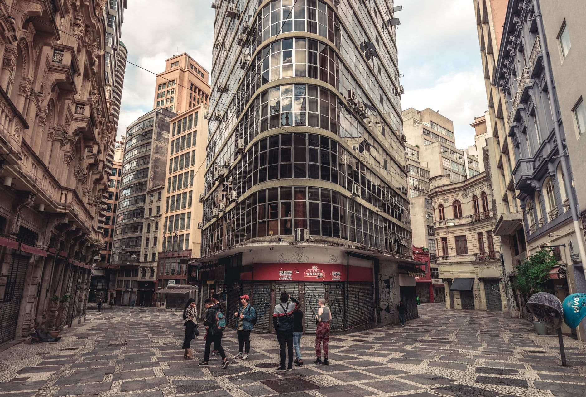 Art Deco buildings with tourists in a historic urban setting, ideal for travel and architecture themes.